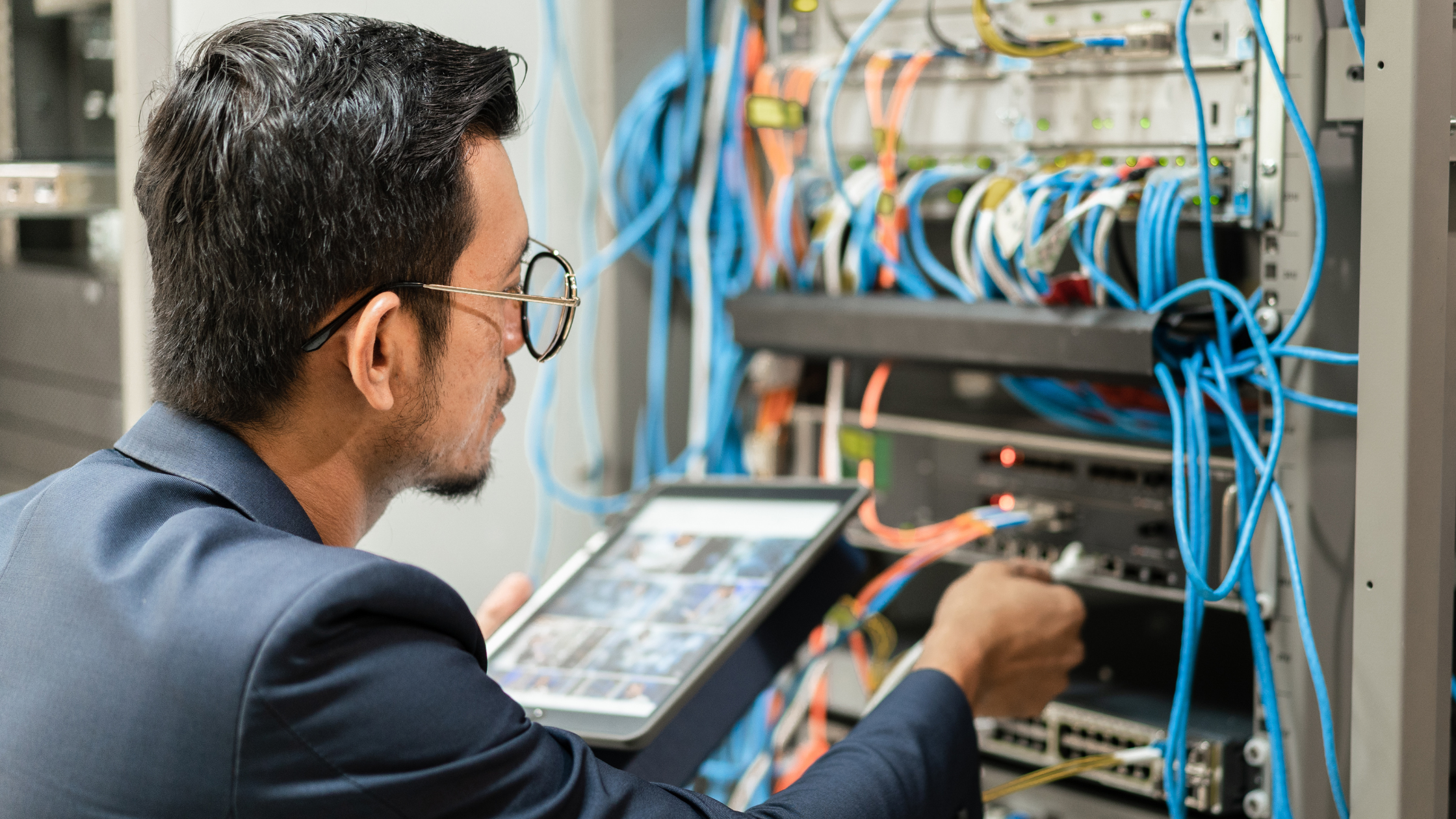 IT Technician Fixing Server